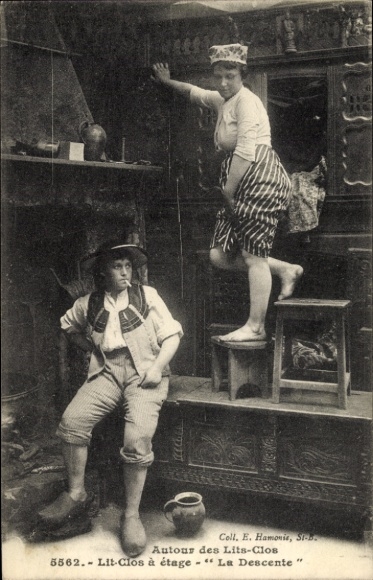 Postcard women at the cupboard bed, traditional costume, cigarette