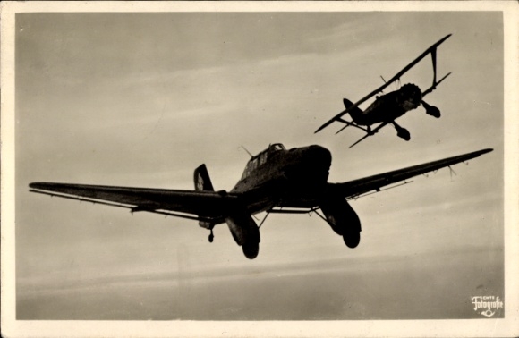 Postcard German Air Force, dive bomber Junkers Ju 87 is attacked by a fighter