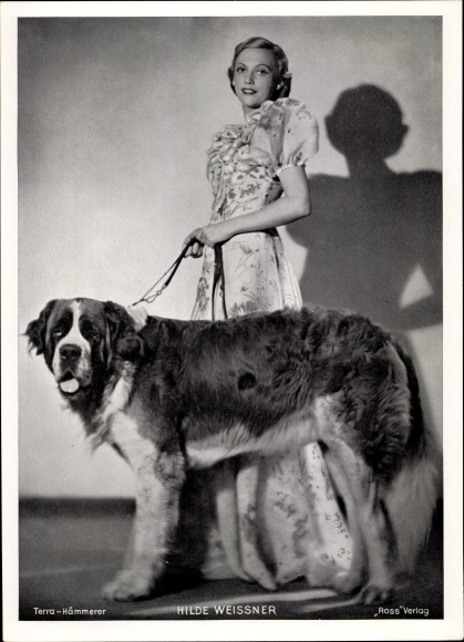 Photo actress Hilde Weissner, standing portrait in dress, dog, St. Bernard