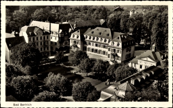 Postcard Bad Bertrich on the Mosel Eifel, aerial view of historic buildings, green trees