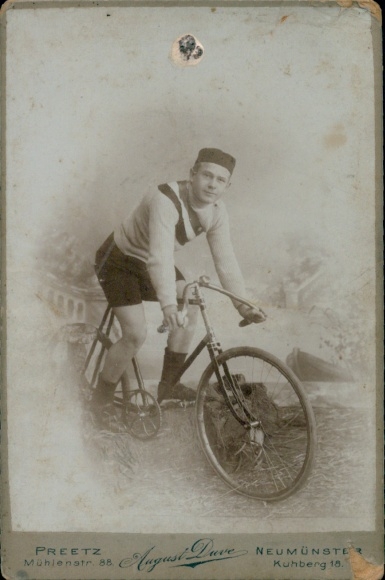 Cabinet Photo Preetz in Schleswig Holstein, man on a bicycle, racing driver