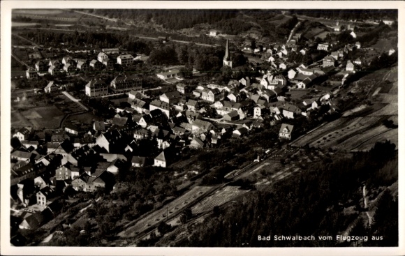 Postcard Bad Schwalbach im Taunus, aerial view of houses, trees, church, city view