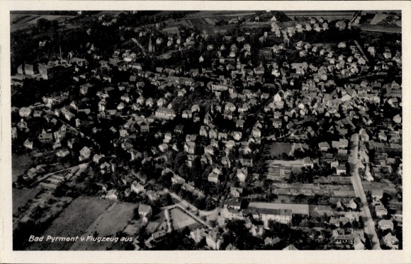 Postcard Bad Pyrmont in Lower Saxony, aerial photograph, city view, houses, trees, streets