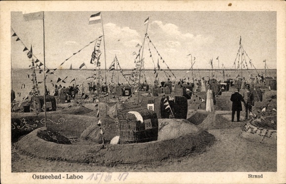 Postcard Ostseebad Laboe, Marine Ehrenmal, Ostseebad beach with many people, stalls and flags