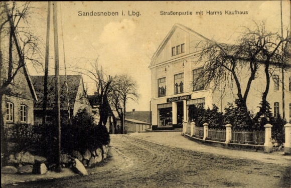Postcard Sandesneben in Lauenburg, street section with department store Heinrich Harms