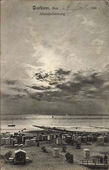 Postcard North Sea resort Borkum in East Frisia, beach with beach chairs, evening atmosphere, sky with clouds,