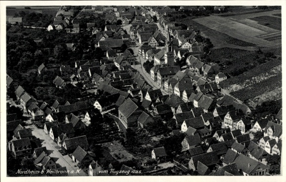 Postcard Nordheim am Neckar, aerial view of Nordheim, building structures, church, fields
