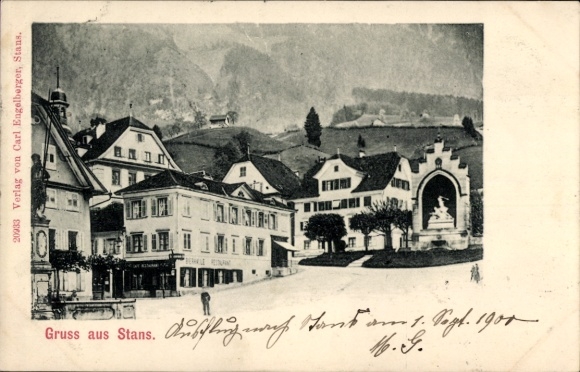 KP Stans Canton Nidwalden, zabytkowe budynki, fontanny, góry w tle, pozdrowienia ze Stans