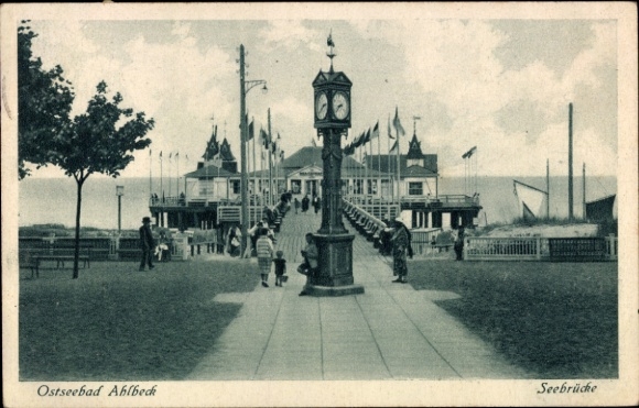 Postcard Ostseebad Ahlbeck on Usedom, Baltic Sea resort pier, clock, people, flags