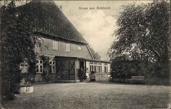 Ak Bokhorst in Sleeswijk-Holstein, huis met rieten dak, bewoners