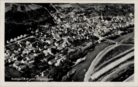 Postcard Aldingen in Württemberg, aerial view of numerous houses, river, bridge