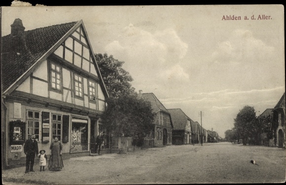 PC Ahlden an der Aller, family in front of a shop, Maggi advertising sign