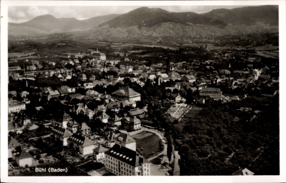 Postcard Bühl in Baden Black Forest, aerial view of Bühl, wooded mountains in the background, architecture