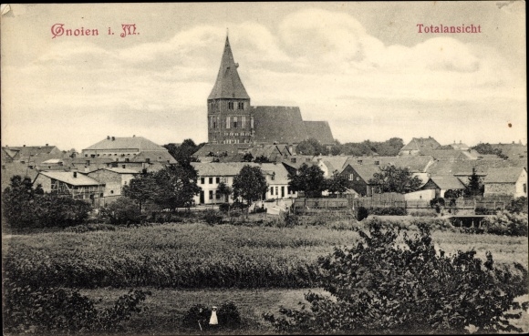Postcard Gnoien in Mecklenburg, total view of the village, church