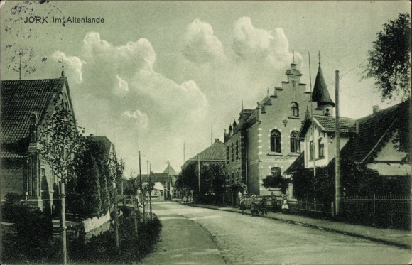 Postcard Jork in the district of Stade, street section with residential buildings, group of children