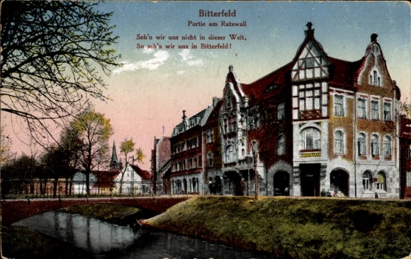 Postcard Bitterfeld in Saxony-Anhalt, view of a building, watercourse, text about Bitterfeld