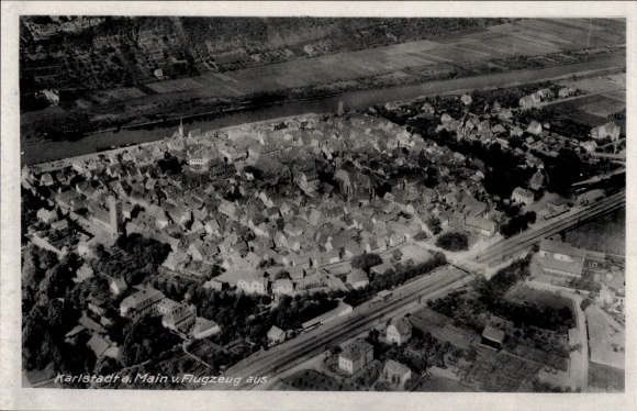 Postcard Karlstadt am Main Lower Franconia, aerial photograph of Karlstadt, Main, Gasthaus zur Eisenbahn, 1944