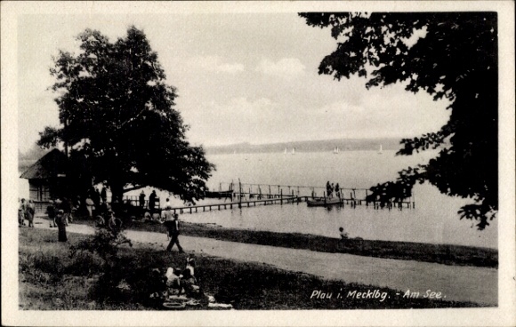 Postcard Plau am See Mecklenburg, lake landscape, wooden walkways, people on the beach, trees, idyllic a...