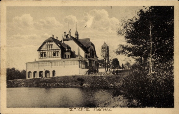Postcard Remscheid in the Bergisches Land, city park, a large house on the shore of a lake