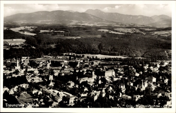 Postcard Traunstein in Upper Bavaria, aerial view of mountains in the background, black and white photography