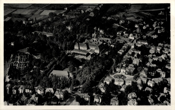Postcard Bad Pyrmont in Lower Saxony, aerial view of green surroundings, architecture