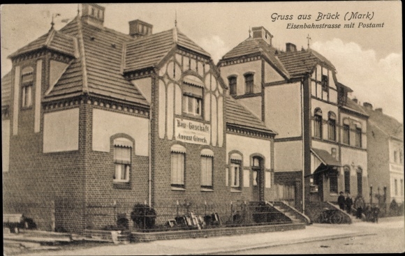 Ak Brück in der Mark in Brandenburg, Eisenbahnstrasse met postkantoor, bouwwinkel