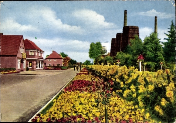Postcard Wiesmoor in Ostfriesland, floral decorations at the gatehouse