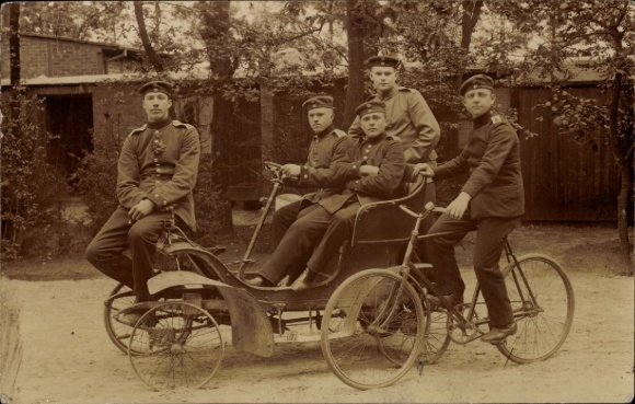 Photo Postcard German soldiers in uniforms, imperial era, bicycle