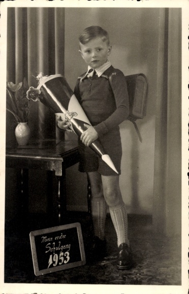 Photo Postcard congratulations on starting school, boy with sugar bag and school bag, blackboard, 1953