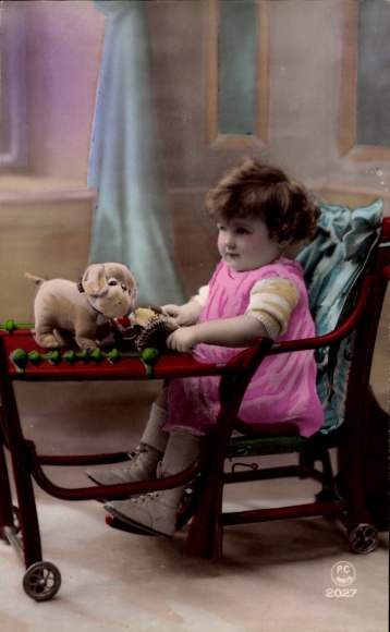 Postcard Little girl at the table, stuffed dog