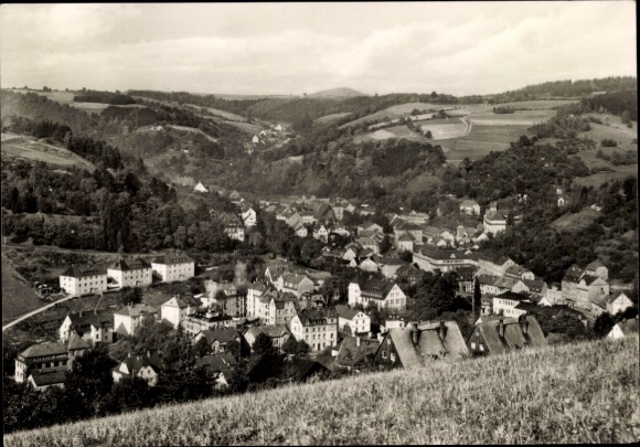 Postcard Glashütte in Saxony, landscape with hills, many houses, trees, historical architecture