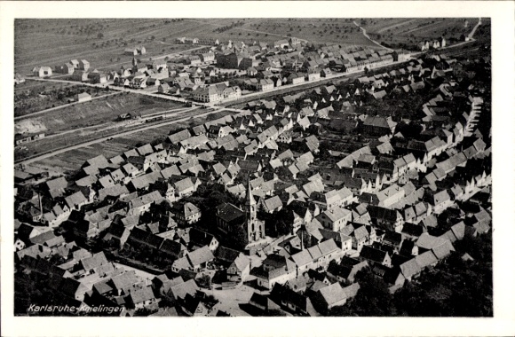 Postcard Karlsruhe in Baden, aerial view of Karlsruhe with many roofs and a church