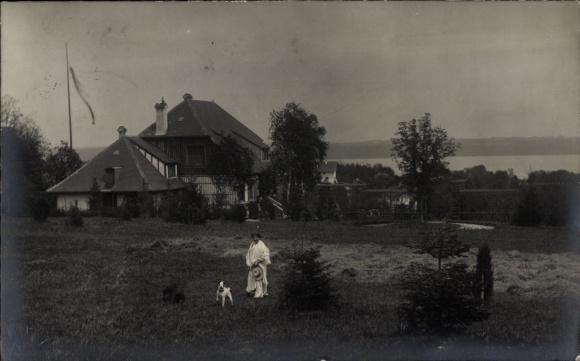 Photo Postcard Tutzing on Lake Starnberg Upper Bavaria, woman with dog on a meadow, town view