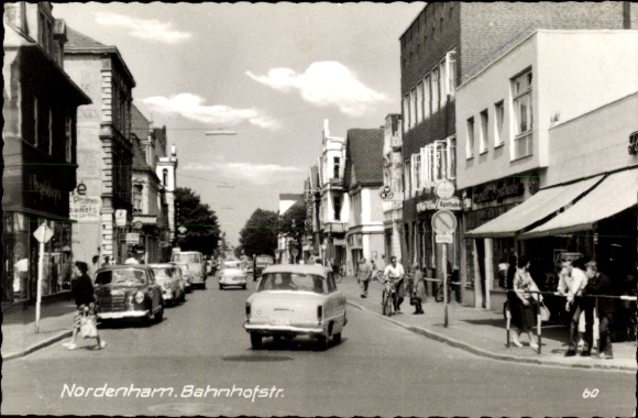 Postcard Nordenham in Oldenburg Lower Saxony, Bahnhofstraße, traffic, passers-by, pharmacy