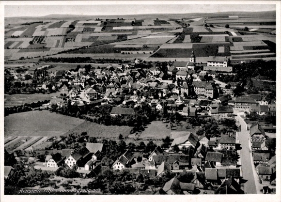 Ak Arnstein im Südharz, Luftaufnahme von  viele Häuser, Landschaft, Felder