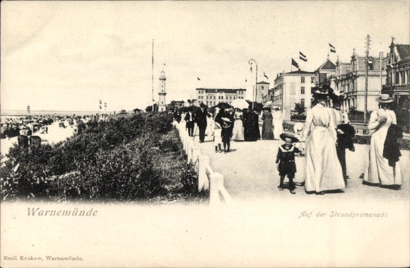 Postcard Ostseebad Warnemünde Rostock, beach promenade, people in dresses, flags, lighthouse