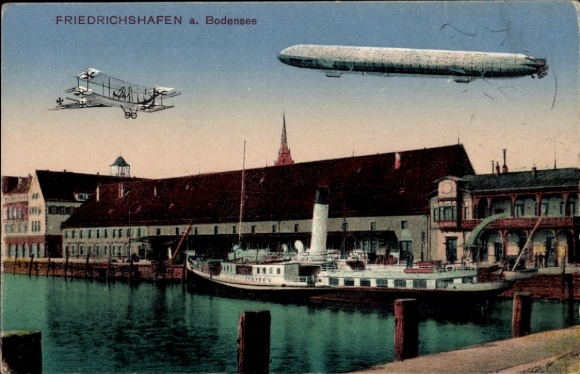 KP Friedrichshafen nad Jeziorem Bodeńskim, sterowiec nad miastem, dwupłatowiec, parowiec