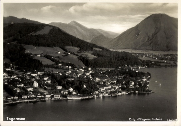 Postcard Tegernsee in Upper Bavaria, aerial view of mountains and houses, calm water, black and white