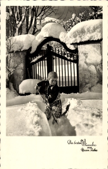 Happy New Year, boy shoveling snow