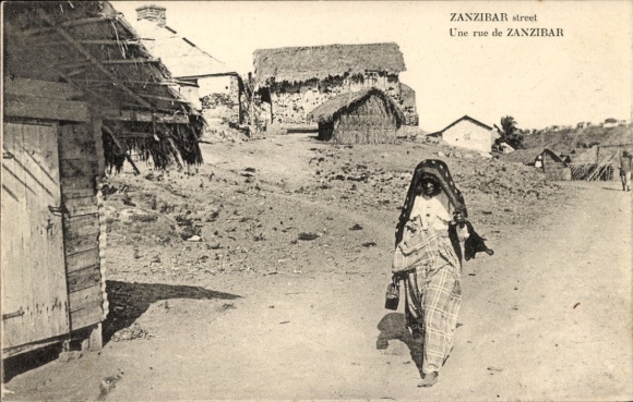 Postcard Zanzibar Tanzania, street, woman, residential buildings