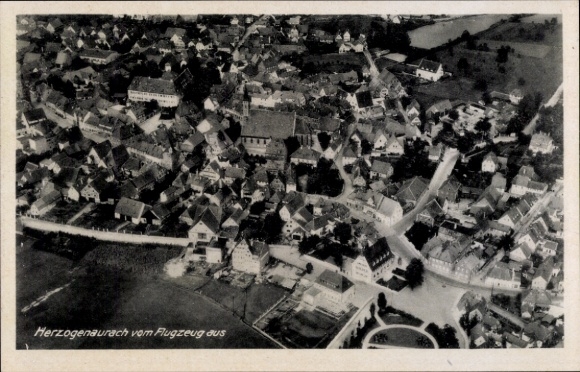 Postcard Herzogenaurach in Middle Franconia, aerial view of houses, country road