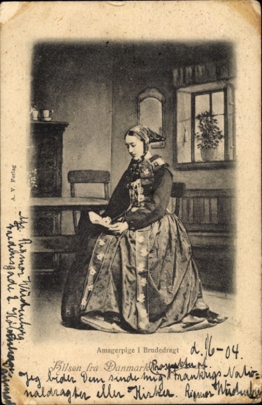 Postcard Denmark, woman reading a book in traditional costume