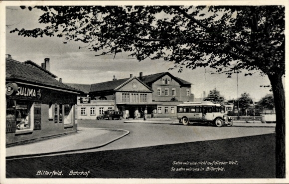 Postcard Bitterfeld in Saxony-Anhalt, train station, forecourt, bus, shop Sulima