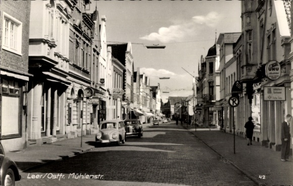 Postcard Leer in East Frisia, city view Mühlenstraße, historical buildings, cars, clouds