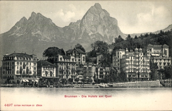 KP Brunnen Kt Schwyz, pocztówka z hotelami na nabrzeżu, w tle góry, nabrzeże