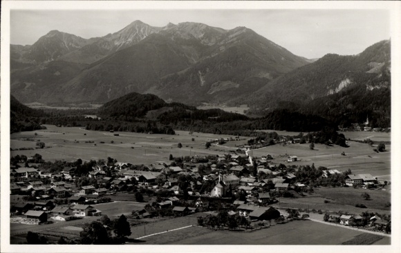 Postcard Unterwössen in Upper Bavaria, aerial photograph, buildings, meadows, mountains in the background, Geigelstein