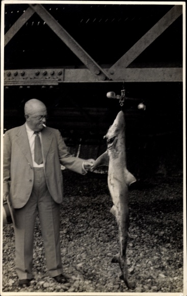 Photo Postcard Man in a suit with a caught shark