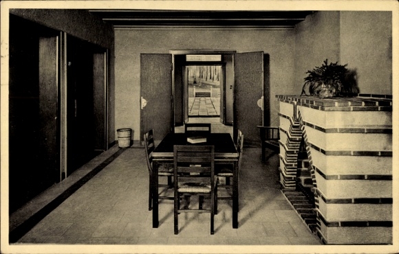 Postcard Springe am Deister, interior with table, chairs and view of the outdoor area, fireplace