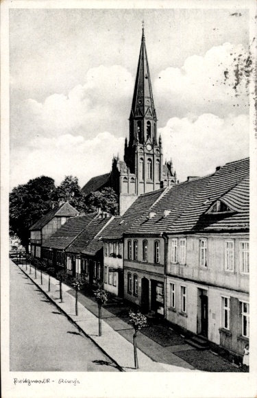 Postcard Pritzwalk in the Prignitz, church with high tower, old houses, city view, trees