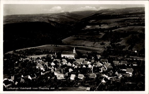 Postcard Mainhardt in Württemberg, aerial view of a village, church visible, rural surroundings, black
